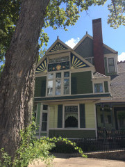 This Victorian style house in Burton was freshly painted green with yellow and orange accents to bring out the beautiful details. Very meticulous attention to detail went into this historic Century home