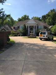 The Northcoast College Painters van in front of a newly painted house in Gates Mills