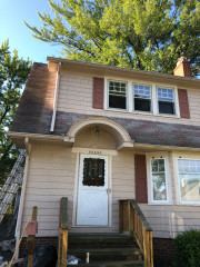 Northcoast College Painters can paint all home exteriors from aluminum siding and stucco, to wood siding, pictured here at this Euclid home