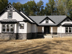 We painted a striking black and white combination on this newly built house in Kirtland