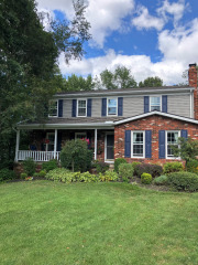 New paint on the siding, trim, and shutters, compliments the beautiful brickwork on this home in Concord